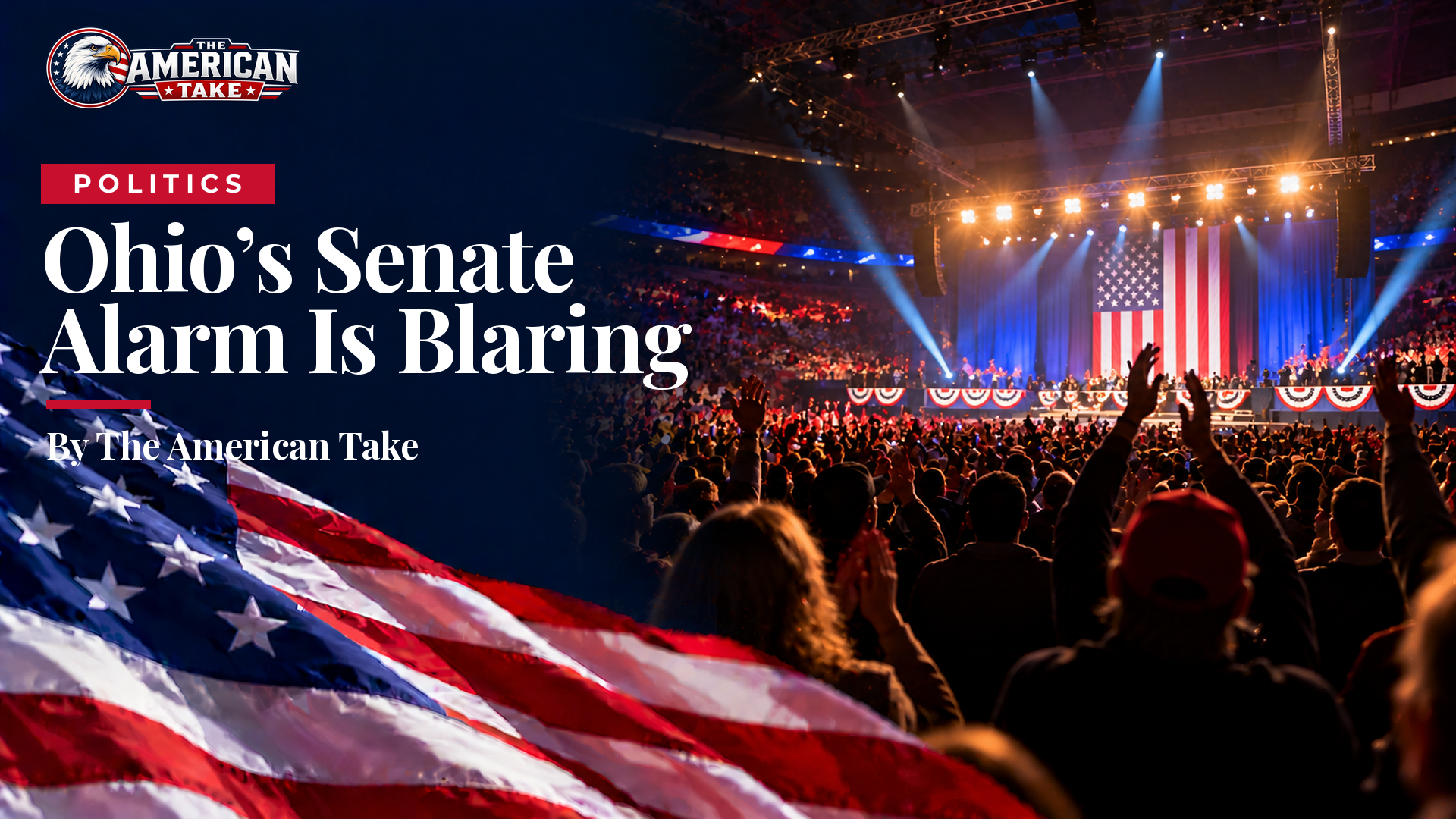A packed arena seen from the back of the crowd, with stage lights and red, white and blue bunting.