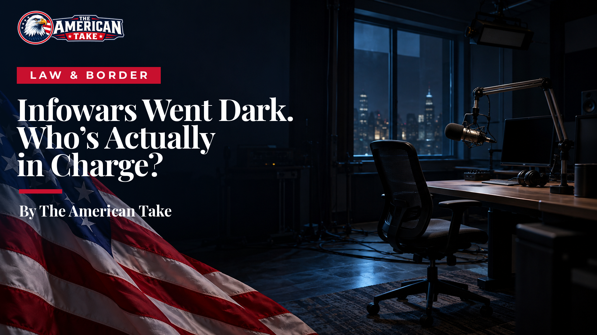 An empty, dark broadcast studio with a single microphone, a vacant desk chair and a dim unlit overhead light.